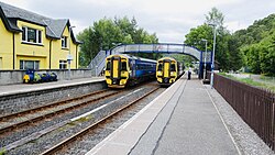 Two Class 158s passing each other at Garve station, one of the passing loops on the line.