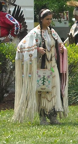 A Native American woman in traditional dress