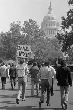 A demonstrator on Capitol Hill demands Nixon's impeachment in October 1973 as the Watergate scandal escalates