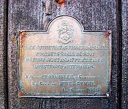 Brass plaque on door at Tremedda farm dating to 1868, warning that poachers shall be shot on first sight