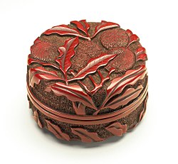 A Ming dynasty red "seal paste box" in carved lacquer