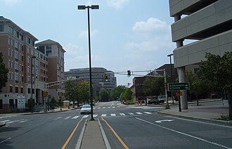 High density development in Cambridge, Massachusetts stimulated by Alewife subway station (right foreground) and TOD zoning. Note the extensive parking above the station, lack of on-street parking, long pedestrian crossing distances, and limited ground-level retail.