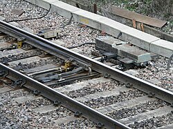 The switch motor (in this case an electric motor) and associated mechanism used to operate this switch can be seen to the right in the picture.