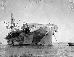Windham Bay displaying severe flight deck damage from Typhoon Connie whilst moored in Apra Harbor, 11 June 1945.