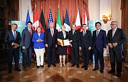 Prime minister Theresa May (in the middle) alongside G7 leaders signing statement against Terrorism at the 2017 Taormina summit