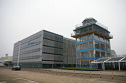 The Convair Building, which houses KLM Cityhopper and KLM offices, and the original Schiphol control tower