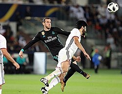 Bale attempting to shoot the ball in the air during the 2017 FIFA Club World Cup semi-final against Al Jazira