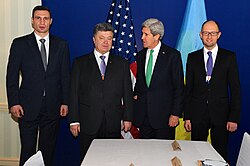 Ukrainian opposition leaders Vitali Klitschko, Poroshenko (second left) and Arsenii Yatseniuk (right) with United States Secretary of State John Kerry (second right) at the Munich Security Conference, 2014