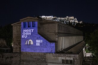 The ancient Roman Agora in Athens illuminated with a Next Generation EU sign