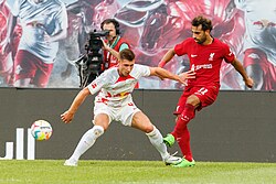 Salah (right) playing for Liverpool in 2022 against RB Leipzig