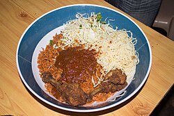 West African jollof rice is cooked with tomatoes and poultry. Some historians suggest this dish influenced the jambalaya.