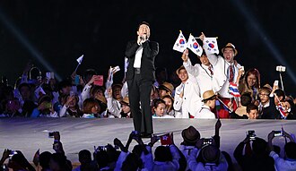 Psy performing at the 2014 Asian Games.