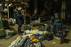 Civilians in Kyiv preparing Molotov cocktails, 26 February