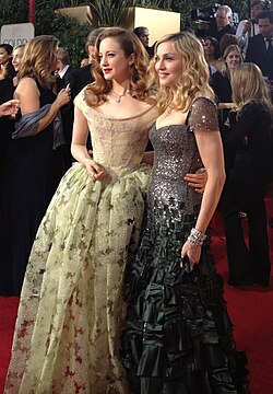 Madonna (right) wearing Reem Acra at the 69th Golden Globe Awards in 2012.