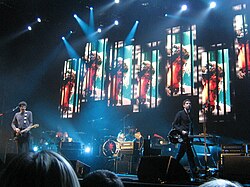 Snow Patrol performing in 2009. Their 2006 single "Chasing Cars" is the most widely played song on UK radio in the 21st century.[103]