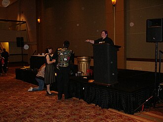 "Alan Smithee" (the man in the gaudy jacket) consulting with his helpers at the 2007 Smithee Awards at the Origins International Game Expo
