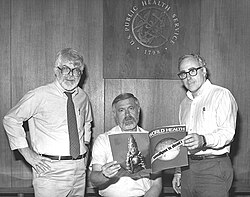Three former directors of the Global Smallpox Eradication Programme reading the news that smallpox has been globally eradicated in 1980