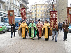 Theophany Crucession in Bulgaria. The priests are going to throw a wooden cross in the Yantra river. Believers will then jump into the icy waters to recover the cross.
