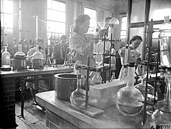Analytical chemists testing samples of explosives at Royal Naval Cordite Factory, Holton Heath during World War II
