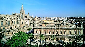 The former Casa Lonja (right), built by Philip II and today the General Archive of the Indies, next to the Cathedral of Seville
