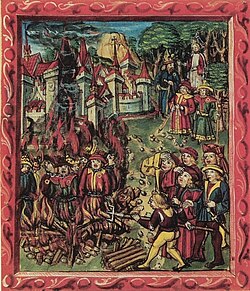 Jews (identified by the mandatory Jewish badge and Jewish hat) being burned