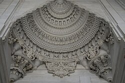 Entrance portal at the Nuruosmaniye Mosque in Istanbul (1748–1755), where traditional muqarnas has been replaced with baroque-style moldings and acanthus friezes