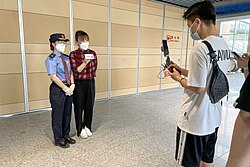 China Railway staff livestreaming on the first day of operation of Beijing Fengtai railway station on 20 June 2022 during the COVID-19 pandemic era