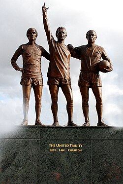 Statue outside Old Trafford of Manchester United Ballon d'Or winners (left to right) George Best, Denis Law and Bobby Charlton, known as the United Trinity.