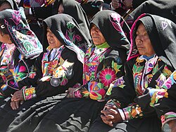 Quechua women in festive dress on Taquile Island on Lake Titicaca, west of Peru