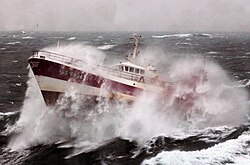 Fishing boat in heavy sea