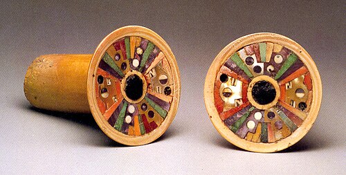 Wari earflare pair — bone, ivory and semi-precious stones. A famous artifact from the Metropolitan Museum of Art.