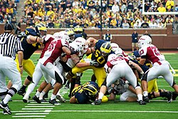 The University of Massachusetts Minuteman playing against the Michigan Wolverines in 2010.