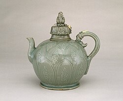 Ewer with Cover, first half of the 12th century. Stoneware with underglaze slip decoration and celadon glaze. Celadon ceramics of the Goryeo dynasty (918–1392) are among the most celebrated works of Korean art. Their luminous green color is the result of iron in both the clay and the glaze oxidizing in a reduction kiln. Brooklyn Museum