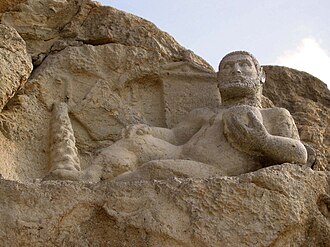 Statue of Heracles Callinicus at Behistun, made for a Seleucid governor named Cleomenes in about 148 BC.