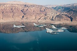 A PAF Mirage III of the No. 7 Bandits Squadron alongside a US Navy F-18 and F-16s of the USAF and RJAF