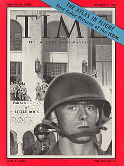 Young U.S. Army paratrooper in battle gear outside Central High School, on the cover of Time magazine (October 7, 1957)
