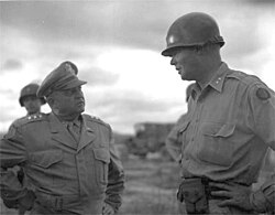Lt. Gen. Walton Walker, Commander of 8th Army (left) confers with Maj. Gen. William F. Dean, Commander Ground Forces in Korea, on 7 July 1950
