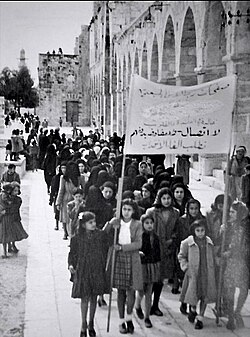 A 1930 Palestinian women's protest in Jerusalem against the British Mandate. The sign reads "No dialogue, no negotiations until termination [of the Mandate]"
