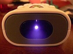 The infrared diode modulates at a speed corresponding to a particular function. When seen through a digital camera, the diode appears to be emitting pulses of purple light.