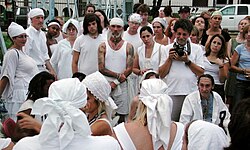 A group of Voodoo revivalists assembling at the Bayou St. John swing bridge on St John's Eve 2007