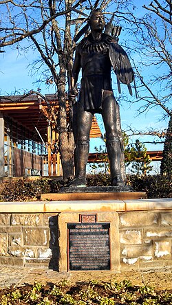 Sculpture of a stylized 18th-century Chickasaw warrior by Enoch Kelly Haney, at the Chickasaw Cultural Center in Oklahoma