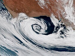 Extratropical cyclones spin clockwise in the Southern Hemisphere, just like tropical cyclones.