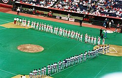 The field markings for football are visible during this April 1995 baseball game at Riverfront Stadium. The dirt "slide pits" used for baseball, common in multipurpose stadiums, are visible.