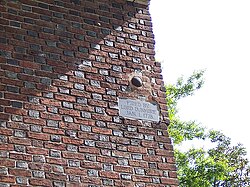A cannonball lodged in the wall of St. Paul's Episcopal Church, fired by Lord Dunmore's fleet during the Revolutionary War