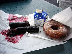 Mustamakkara with lingonberry jam, milk, and a doughnut