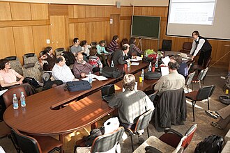 A 2011 RSUH linguistics conference bringing together various prominent Russian "lumpers" belonging to the Moscow School of Comparative Linguistics, including Vladimir Dybo and Georgiy Starostin (standing in front)