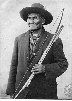 Geronimo with traditional Apache bow and arrow.