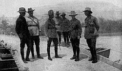 A conference of brigade and divisional commanders with their corps commander on a pontoon bridge spanning the Jordan River. From left to right: Generals Meldrum (New Zealand Mounted Rifles), Ryrie (2nd Light Horse), Chauvel (Desert Mounted Corps), Chaytor (Anzac Mounted Division) and Cox (1st Light Horse).
