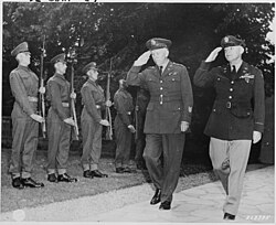 General George C. Marshall with Chief of the Army Air Force General Henry "Hap" Arnold at Villa Urbig on 23 July 1945 during the Potsdam Conference. The two generals return the salute of the Guard of Honor formed by a detachment of Scots Guards of the British Brigade of Guards.