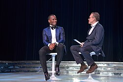 Drogba (left) interviewed during the Peace and Sport international forum in 2017. He was appointed Vice President of the organisation the following year.